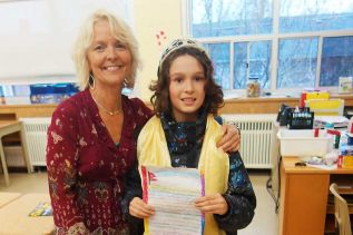 Leslie Myles, managing director of the Limestone Learning Foundation with Central PS student Jacob Reesor, who is holding a letter from a Nepalese student
